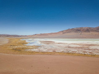 Fototapeta na wymiar Pacana Caldera, San Pedro de Atacama, Andes Desert lake and salt flats