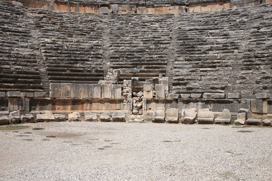 Stone tribunes of the ancient amphitheater in the antique city of Myra in Turkey.
