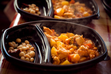 hot dishes.meat and potatoes in a disposable container,for delivery of food at home