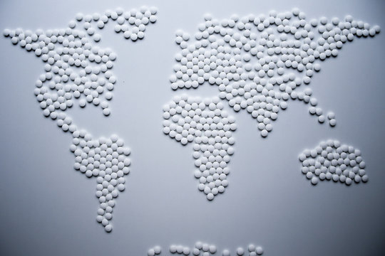World health map concept created from white tablets urgently needed to cure the whole world from viruses and infections that threatening whole population
