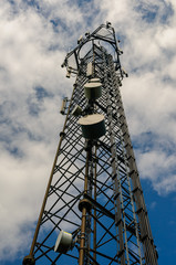Mobile (cell) phone radio transmission tower with microwave dishes and cellular antannae