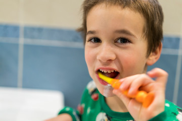 Close-up of young boy brushing teeth with toothbrush Portrait of healthy little boy enjoy cleaning his teeth with a happy face, Happy child brushing his little teeth in bath room, Dental concept