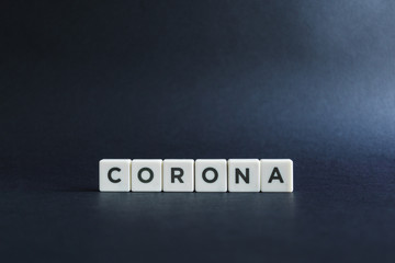 Coronavirus or covid-19 pandemic. Letter block on black background.