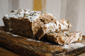 delicious healthy breakfast: baked avocado with chicken egg, toasts with whole grain bread and homemade hummus with lime juice, falafel, tomato slices with feta, parsley, dill and coriander, iceberg 