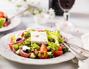 Greek salad of fresh vegetables, olives and feta. Traditional Mediterranean food.
