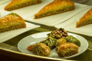 Turkish baklava with pistachio. Traditional dessert for sale in stand. Tasty and delicious food.