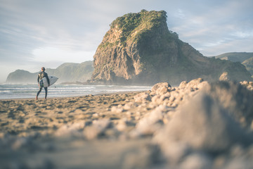 Surfer at Piha Beach