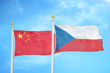Fototapeta na wymiar China and Czech Republic two flags on flagpoles and blue cloudy sky