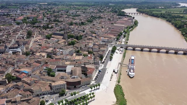 Panoramic aerial view of Libourne city on Dordogne river on sunny summer day, Gironde, France