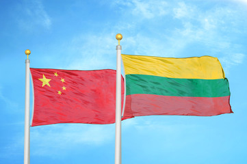 China and Lithuania two flags on flagpoles and blue cloudy sky