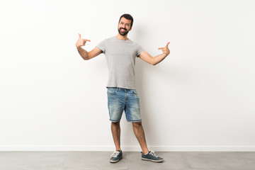 A full-length shot of handsome man with beard proud and self-satisfied