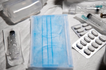 Medicine,  face mask, hand sanitizers and syringe