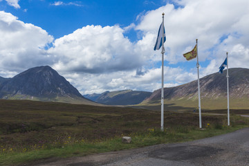 The Saltire or flag of Scotland with Stob Dearg and Buachaille Etive Mor in the background, Rannoch Moor, Glencoe, Scotland 