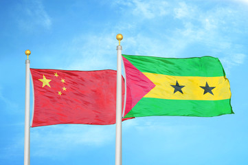 China and Sao Tome and Principe two flags on flagpoles and blue cloudy sky