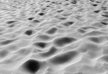 Black and white photo of footprints on the beach, Australia