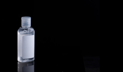 Bottle of antiseptic gel isolated on white, black background..transparent gel jar, medical container