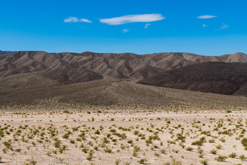 Barren volcanic hills and an alluvial fan in Death Valley National Park