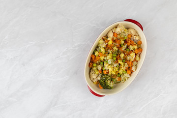 Cooked vegetables salad in the bowl served on the table