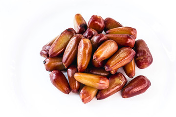 pine nut seed cooked and isolated over white background. Healthy and exotic Brazilian cuisine.