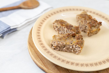Minced meat meatloaf baked and served on the table