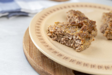 Minced meat meatloaf baked and served on the table