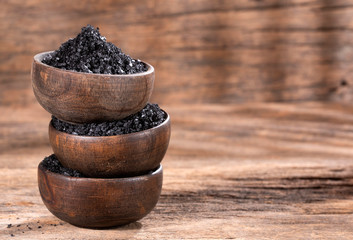 Hawaiian black salt in wooden bowls - text space