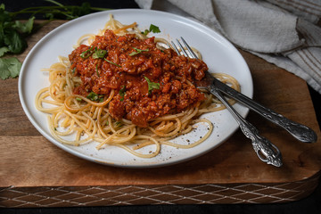 Vegan spaghetti bolognaise on white plate