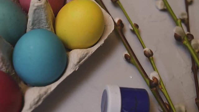 Easter. We paint eggs with dyes. Seals, multi-colored eggs. Beautiful background for easter. Holiday, items layout.