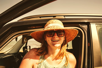 Fototapeta premium woman in summer car and free space for your decoration 