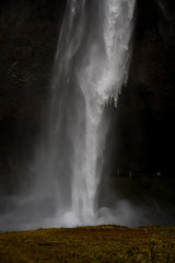 Closeup Image of Waterfall in a dark black background to isolate the water falling down
