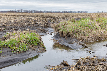 Spring Storms and heavy rain Midwest caused flooding and soil erosion in farm fields