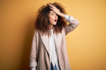 Young beautiful brunette woman with curly hair and piercing wearing casual t-shirt and diadem...