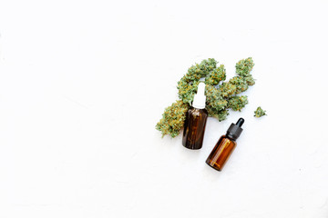 Medical Marijuana Cannabis Oil Extract In Bottle On White Background With Copy Space. Selective Focus, Top View