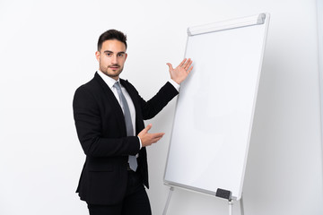 Young man giving a presentation on white board