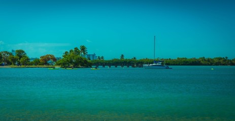 blue sea beach ocean water island tropical sky summer landscape vacation sand nature caribbean florida sun pacific boat bridge green