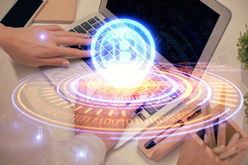 Double exposure of woman hands typing on computer and crypto market theme hologram drawing. Blockchain concept.