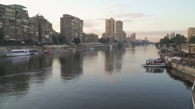 Branch of river Nile and Gezira island at dusk, Cairo, Egypt. Panning video.