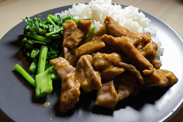Close-up view of garlic stir fried pork.