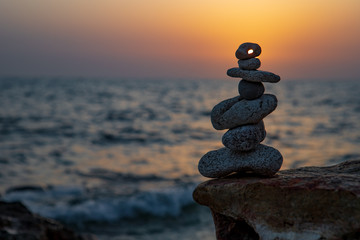 Zen concept. Sunset. The object of the stones on the beach at sunset.  Relax & Meditation. Zen stones