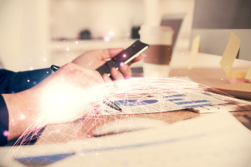 Obraz premium Double exposure of man's hands holding and using a phone and social network theme drawing.