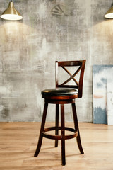 Wooden bar stool and stucco wall background, front view - 333573936