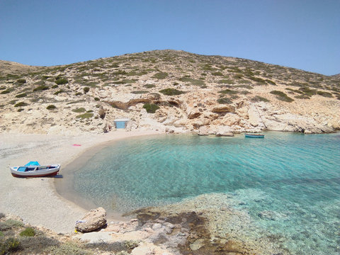 View of Kalotaritissa beach on the beautiful Greek island of Donousa.  A deserted shingle beach in a quiet bay, on a summers day.