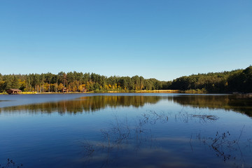 Beautiful landscape view of the lake with the reflection of trees and the sky in it. Rest in a campaign on the western part of Ukraine.