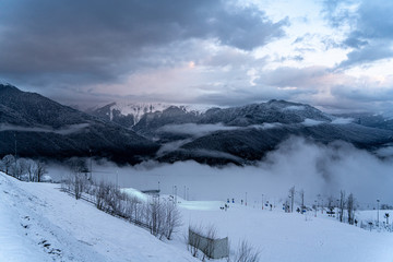 winter mountain landscape with mountains and clouds