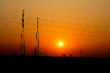 Sunset on the background of the road and antennas. Beautiful landscape. Background.