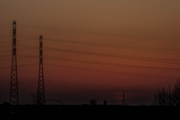 Fototapeta premium Sunset on the background of the road and antennas. Beautiful landscape. Background.