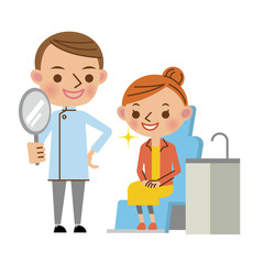 治療後に患者へ鏡を見せる歯科医（若い男性）