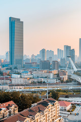 Early morning city scenery of Chifeng Bridge in Tianjin, China © Govan