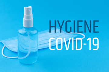 Hygiene products for coronavirus. Coronavirus protective equipment - medical protective mask and antiseptic sanitizer spray. Coronavirus prevention medical masks and hand sanitizer spray.