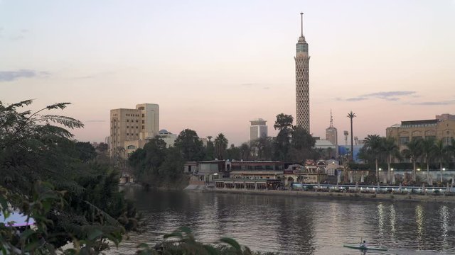 The Cairo tower, Nile river and Zamalek district at dusk. Panoramic view.

